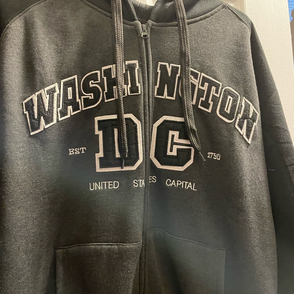 Jacket. Brand is NT SOUVENIR, The size is L, color is charcoal grey with black.